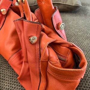 B Makowsky orange purse with two straps